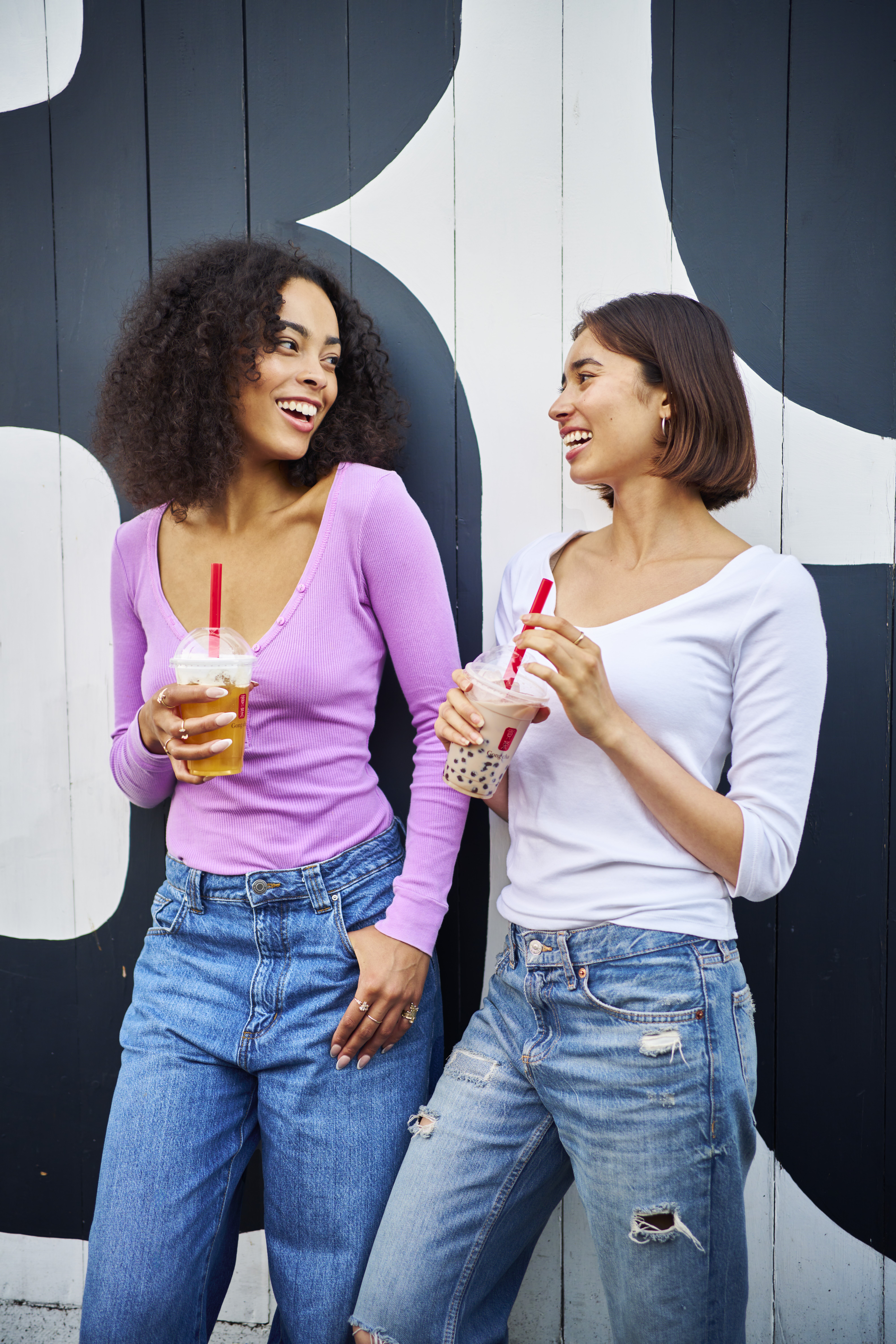Photo of Gong cha employee holding a tea cup with both hands